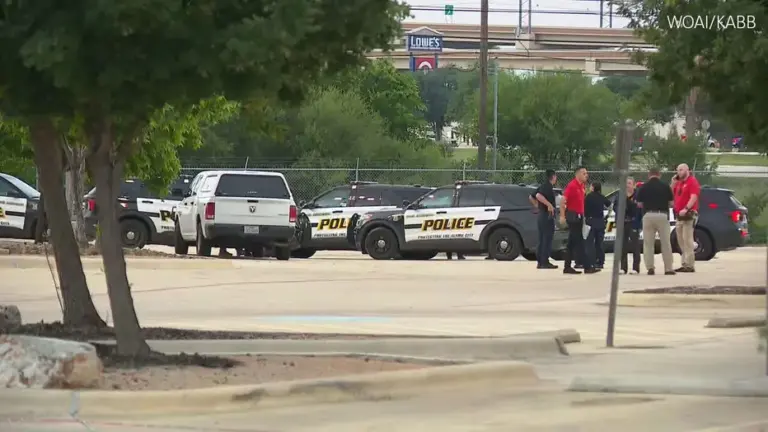 Police vehicles are parked at the scene of a vehicle fire in San Antonio, Texas, where two children were found dead inside the car May 15, 2026.