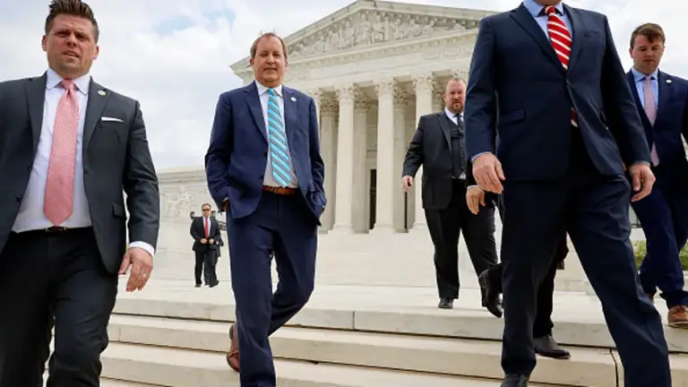 (2nd L-R) Texas Attorney General Ken Paxton (C), Texas Solicitor General Judd E. Stone and Missouri Attorney General Eric Schmitt walk out of the U.S. Supreme Court after arguments in their case about Title 42 on April 26, 2022 in Washington, DC. Paxton and Schmitt, who is running for the U.S. Senate in Missouri, are suing to challenge the the Biden Administration's repeal of the Trump Migrant Protection Protocols—aka