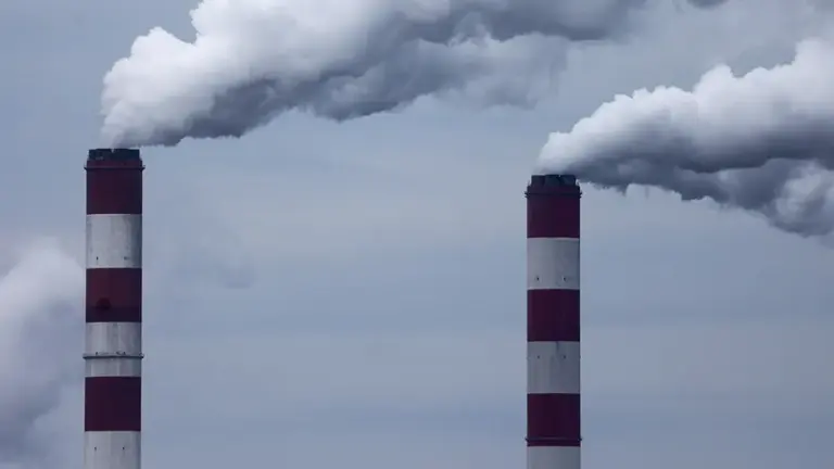 Smokestacks of a power plant are seen in April 2025.