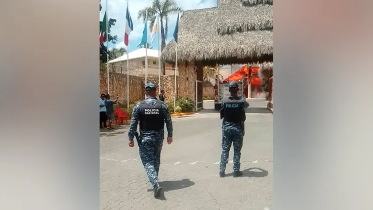 Two police officers in front of resort