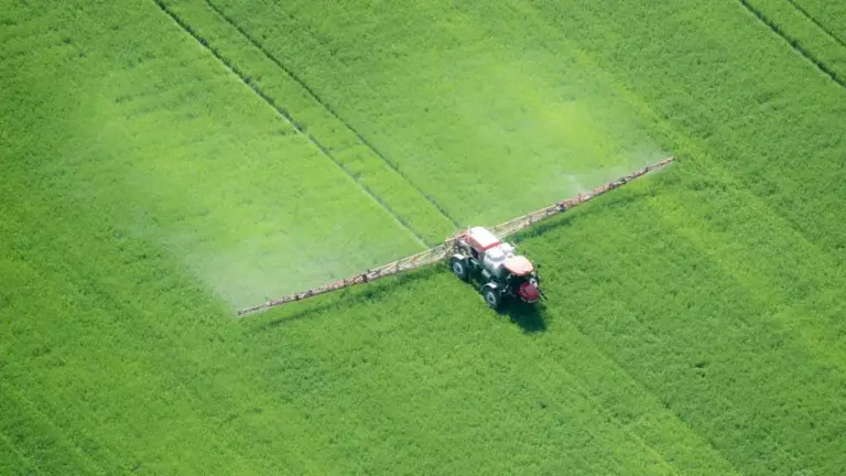 FILE - An aerial image shows spray application in a green agricultural field on the eastern shore of Maryland. (Photo by: Edwin Remsburg/VW Pics via Getty Images)