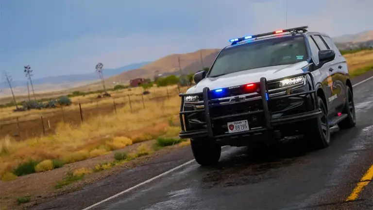 A Texas Highway Patrol cruiser travels down a Texas road in 2024.