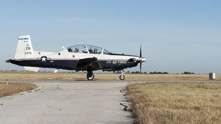 A T-6A Texan II waits for another T-6A to pass before taxing onto the runway Nov. 1, 2017, at Sheppard Air Force Base, Texas.